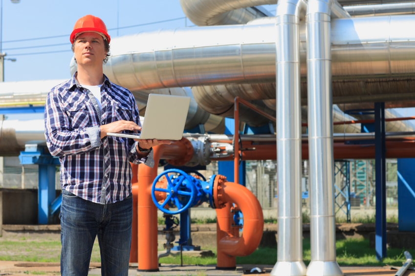 engineer next to power plant